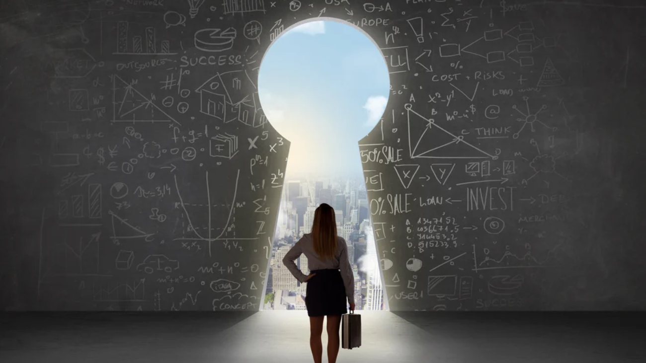 Business woman looking at keyhole with bright cityscape concept background